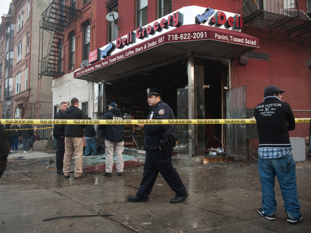 <p>A police officer at the scene of the fire at 587 Franklin Avenue on Monday November 12th, 2012.</p>
