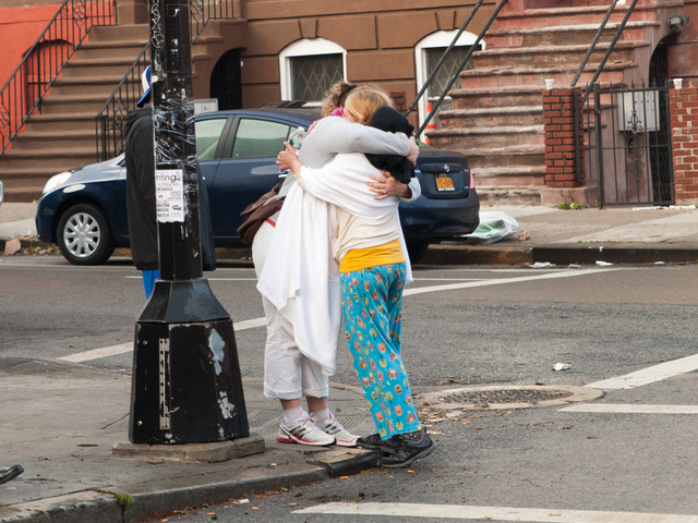 <p>Victims of the fire console each other outside of 587 Franklin Avenue in Brooklyn on Monday November 12th, 2012.</p>
