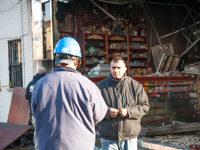 <p>Owner of the Deli, Emad Alharie, speaks to investigators at the scene on Monday November 12th, 2012.</p>
