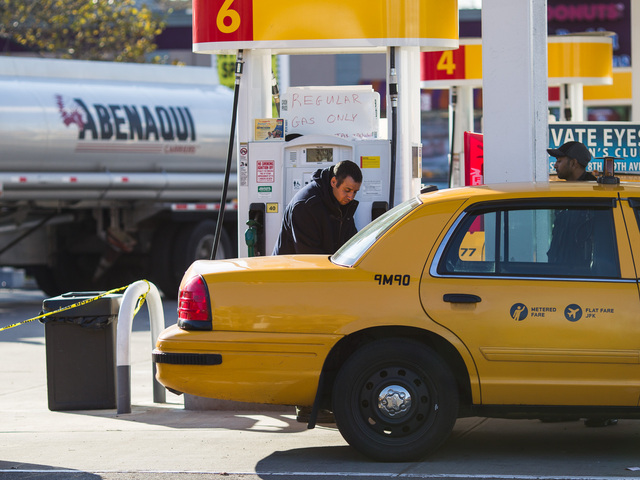 <p>A yellow cab driver re-fuels at the Shell gas station on Northern Blvd., in Queens on Nov. 9, 2012.</p>
