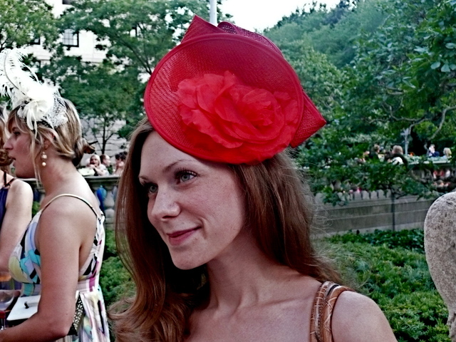 <p>Miss Lydia Harrison in a vibrant straw and silk flower fascinator style at the Frick Garden Party.</p>
