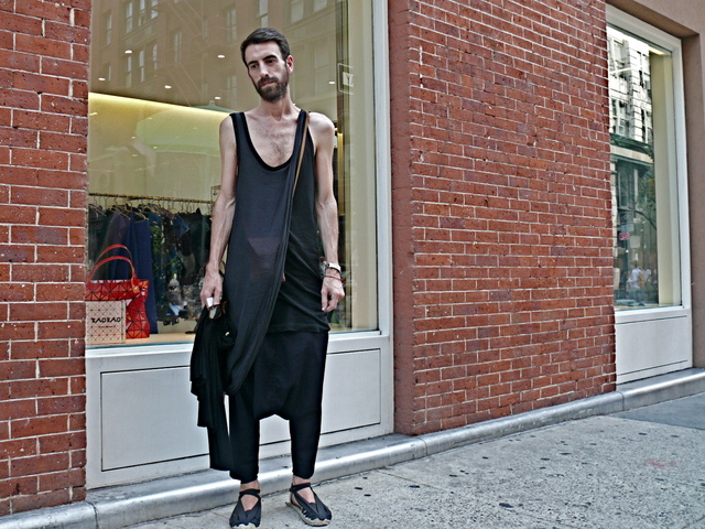 <p>Spanish fashion designer Joseba wore inky black and indigo draped knit ensemble by Comme des Gar&ccedil;ons in SoHo.<br />
	&nbsp;</p>
