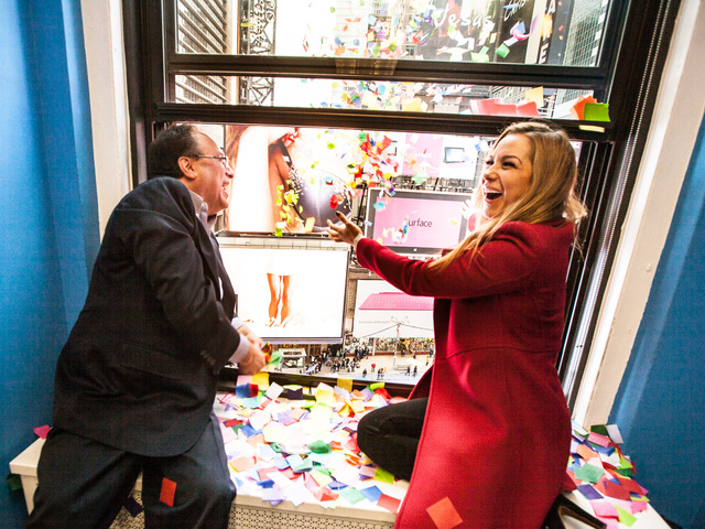 <p>This year's Times Square New Year's Eve host Allison Hagendorf and Alliance President Tim Tompkins throw confetti from eight stories above Times Square during the annual Airworthiness Test on Dec. 29th, 2012.</p>

