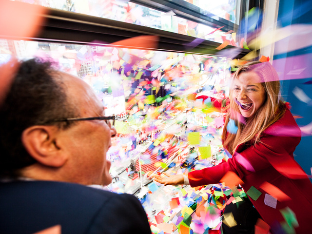 <p>Times Square New Year's Eve host Allison Hagendorf and Tim Tompkins, Alliance president, throw confetti over Times Square during the annual Airworthiness Test on Dec. 29th, 2012.</p>
