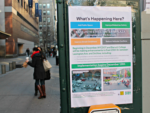 <p>A sign posted on East 25th Street alerts residents and students about the work to convert the block into a public plaza.</p>

