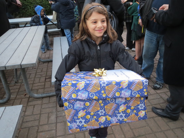 <p>A girl carries a box of Christmas letters to Gracie Mansion, which ask Mayor Michael Bloomberg to grant about 1,000 children's holiday wish &mdash; that he put a halt to the East 91st Street Marine Transfer station.</p>
