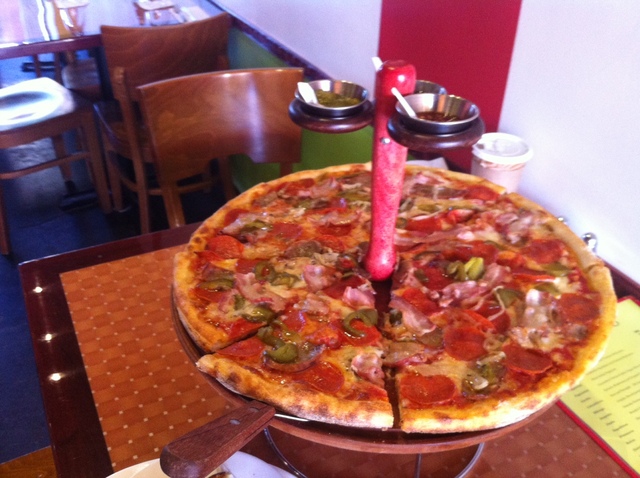<p>The Circo pie, Pagliaccio's specialty, is a thin-crust pie with sliced pepperoni, sausage, pancetta, green peppers and onions, served on a special tray created by Bonetto that holds three sauces: a red pepper sauce, a parsley and basil sauce and a spicy green tomatillo and jalapeno sauce.</p>
