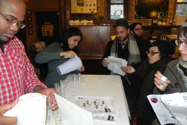 <p>Michelle Cruz, owner of East Harlem Cafe, pours a taste of coquito at the 2011 qualifiers at her eatery.</p>
