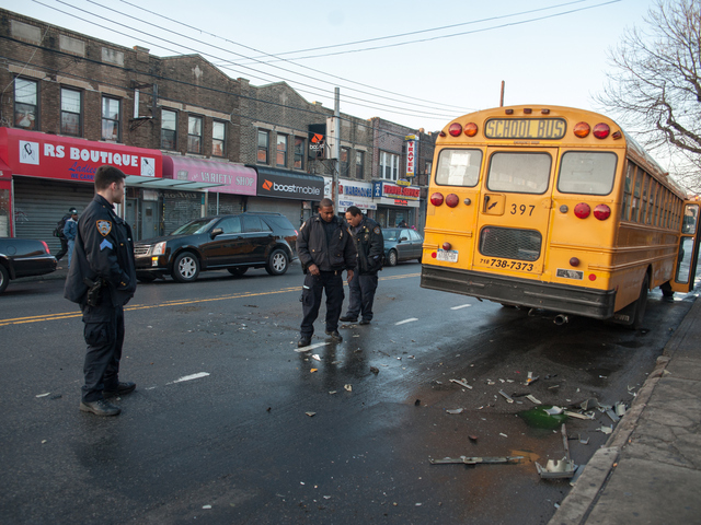 <p>Officers clear away debris at the scene of the crash on Monday December 03rd, 2012.</p>
