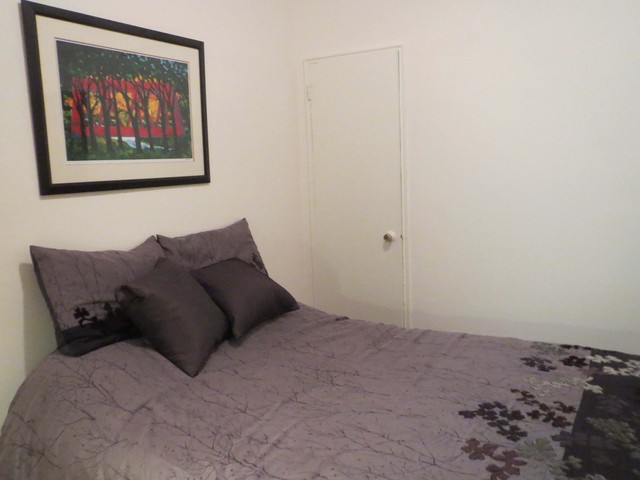 <p>The bedroom of this co-op &mdash; at 531 E. 87th St., 2D &mdash; features a clothes closet as well as a horizontal storage space built into wall, near the ceiling.</p>
