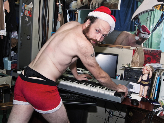 <p>Flux Factory artist-in-resident Adrian Owen strips down to his skivvies &ndash; and a Santa hat &ndash; as Mr. December.</p>
