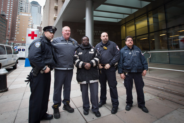 <p>George McCann and Jean Bernard from the Port Authority, as well as Roy Renna and Roy Soto from the EMS of the New York Downtown Hospital a few hours after delivering a baby boy in the Holland Tunnel on Dec. 26, 2012.</p>
