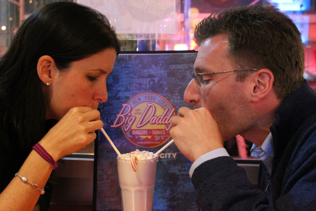 <p>Jamie Drogin and Jeffrey Lehman share a milkshake at the table where they got engaged.</p>

