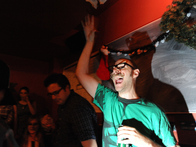 <p>A competitor reacts to getting a "spinny dip" &mdash; when the dreidel goes into the hole at the end of the table.</p>
