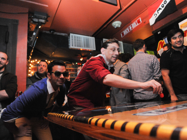 <p>Rob Frank (in sunglasses) and David Goldberg compete against each other at the Major League Dreidel competition at Full Circle Bar in Williamsburg Thursday, Dec. 13, 2012.</p>
<p>&nbsp;</p>
<p>&nbsp;</p>
<p>
	<meta charset=