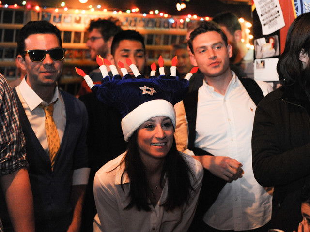 <p>Rachel Koch wears a festive Hanukkah hat to the dreidel competition.</p>
