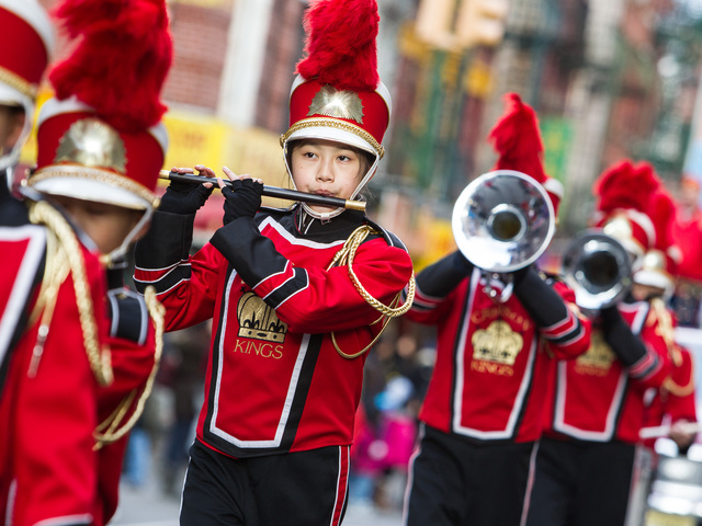 <p>The Crimson Kings marching band plays at the East Meets West Parade in Chinatown & Little Italy on Dec. 22nd, 2012.</p>
