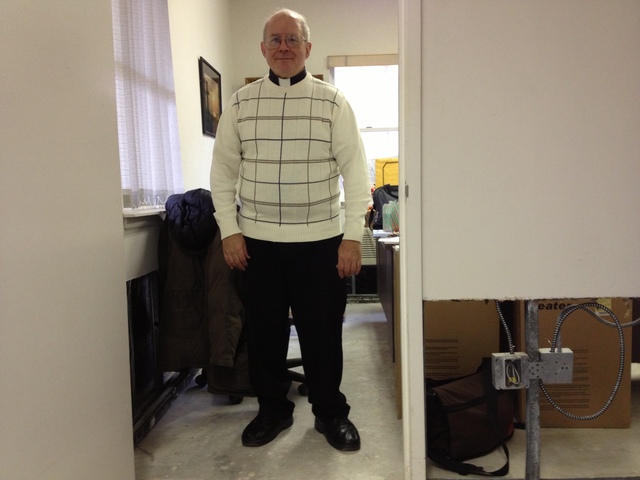 <p>Monsignor Michael Curran at the St. Thomas More Roman Catholic Church, where the walls were damaged by Hurricane Sandy flooding.</p>
