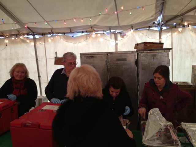 <p>Richard Blanck, second from left, his wife, Pat, second from right, and Red Cross worker Carolyn Ross, far right, served food at a Red Cross warming center in Belle Harbor Dec. 25, 2012.</p>

