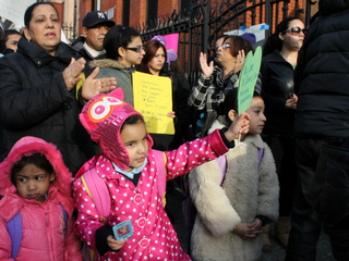 <p>Advocates protested the school closures ahead of the panel vote.</p>
