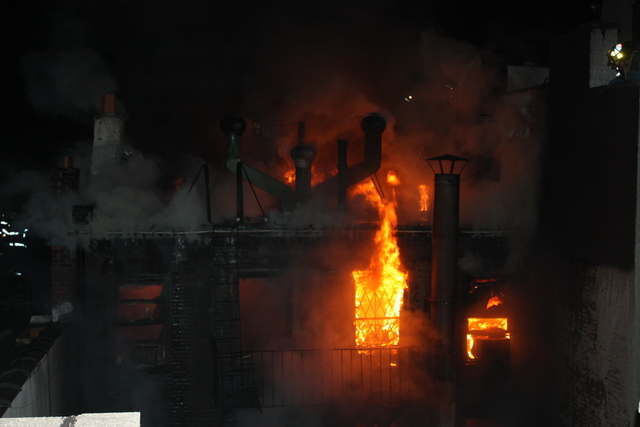 <p>Flames shot out of 41 Spring St., a five-story building, Jan. 10, 2013.</p>
