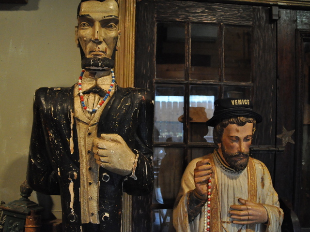 <p>A statue of Abe Lincoln and other antiques and knick-knacks are for sale in the former cafe.</p>
