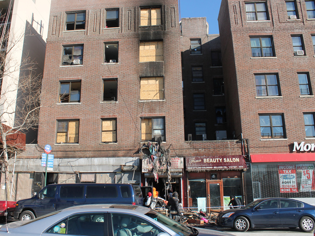 <p>Workers began clearing out debris at 2440 Amsterdam Ave. on Jan. 24, 2013.</p>
