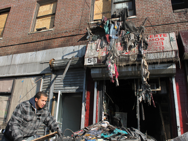 <p>Several businesses were on the ground floor of the building, including a hair salon and a MoneyGram on Jan. 23, 2013.</p>
