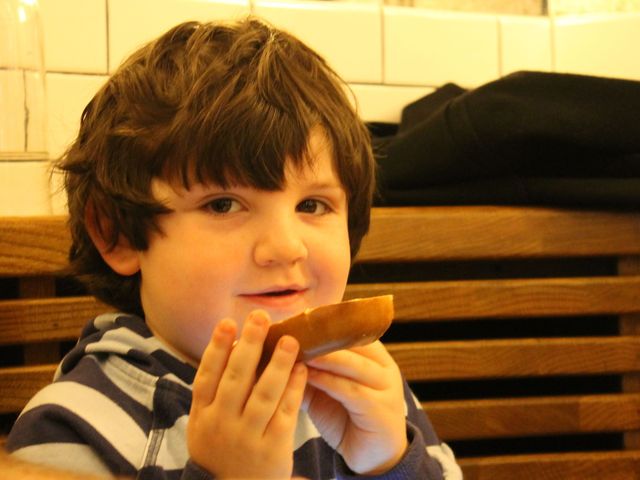 <p>Zach Susel, 4, enjoys a bagel, which was added to The Smith's menu especially for the Upper West Side.</p>

