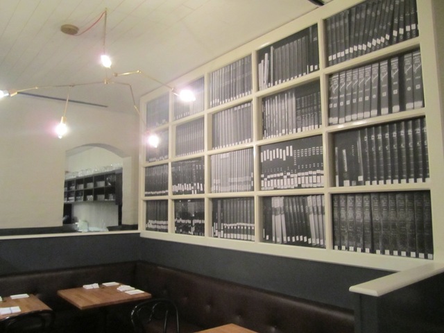 <p>The West 10th Street restaurant Louro&nbsp;has painted trompe l'oeil bookshelves on two of its walls.</p>

