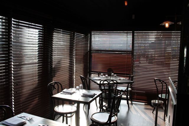 <p>The dining room fits 100 people and serves French food with a twist.&nbsp;</p>
