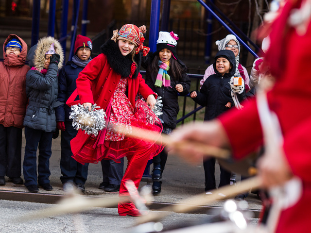 <p>A dancer entertains children at the Annual Three Kings Day Parade in East Harlem on Jan. 4, 2013.</p>
