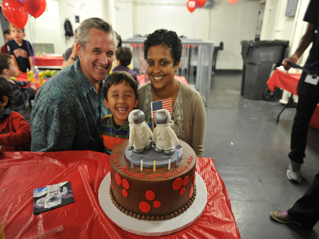 <p>Ed Hartzog poses with Nalika Nanayakkara, his wife, and their 5-year-old son at his birthday party.</p>
