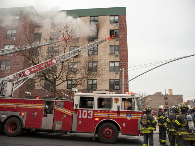 <p>Smoke billows from the Remeeder Houses at 580 Sutter Avenue on Jan. 1, 2013.</p>
