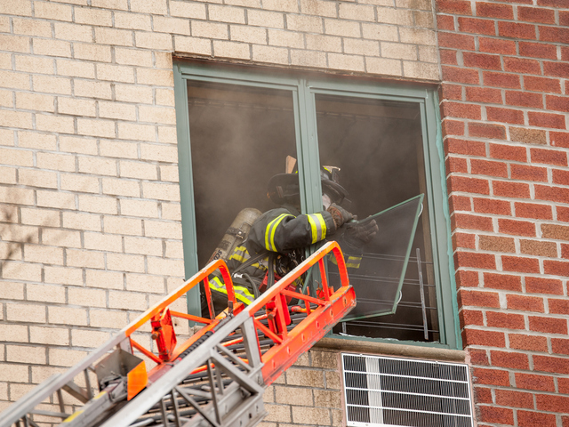 <p>Firemen tackle the fire at 580 Sutter Avenue on Jan. 1, 2013.</p>
