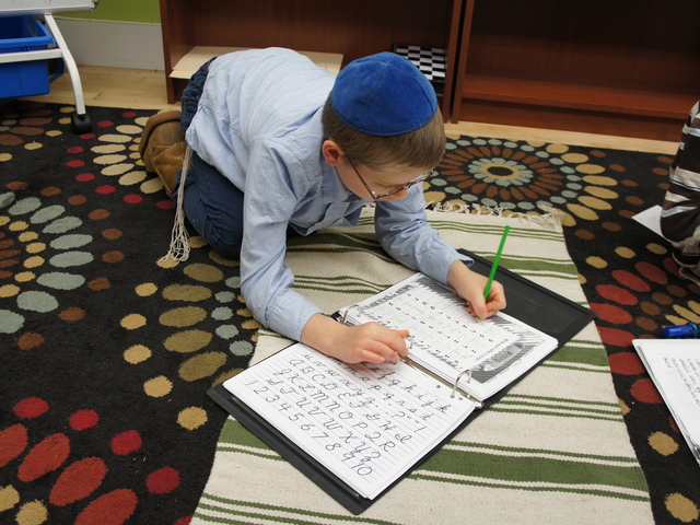 <p>Hard at work at Lamplighters Yeshivah in Crown Heights. Unlike many of the 84,000 other Jewish parochial students in Brooklyn, students at Lamplighters learn religious and secular subjects side by side.</p>
