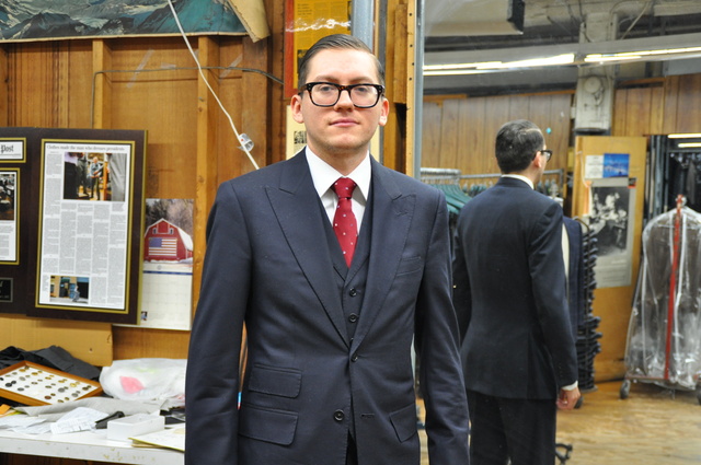 <p>Will Brennan, a Martin Greenfield tailor who is working on the Ghurka partnership, donned one of the company's suits at the workshop.</p>
