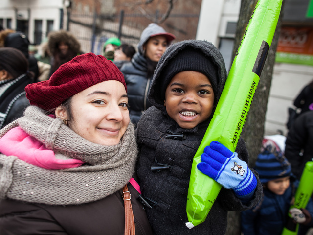 <p>Miss Joann, 24, from New York City, was with her student, Brian, 3, also from New York, enjoying the Three Kings Day Parade in East Harlem on Jan. 4, 2013.</p>
