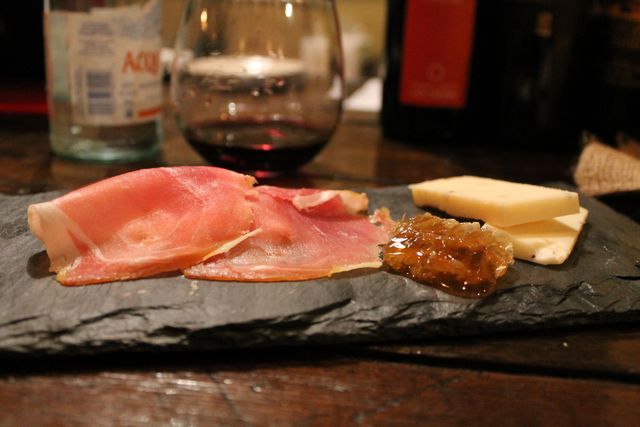 <p>An appetizer offering at Piccolo Cafe. Many dishes are served on black slate plates.&nbsp;</p>
