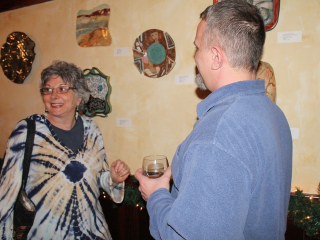 <p>Audrey Cooper, left, molded her pieces as decorative plates.</p>
