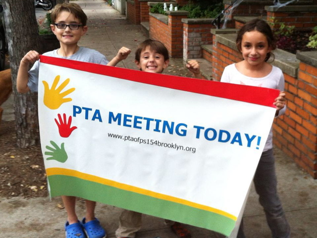 <p>Students at P.S. 154 in Windsor Terrace advertise a PTA meeting.</p>
