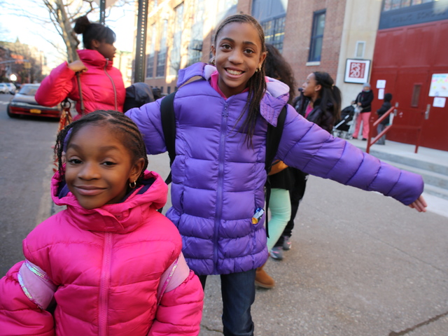 <p>Shelly Peoples, 11, and Anaya Morris, 6, pose outside Anaya's school, P.S. 20 in Brooklyn.</p>
