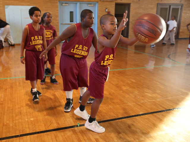 <p>Legends, P.S. 67's after-school basketball team, gears up for a game.</p>
