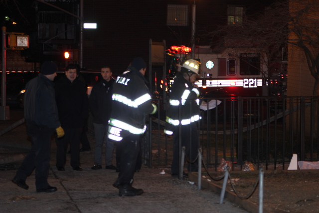 <p>Rescue workers gather outside a building in Brooklyn where a blaze on January 26, 2013 left a 78-year-old woman, Nelly Bermudez, dead.</p>
