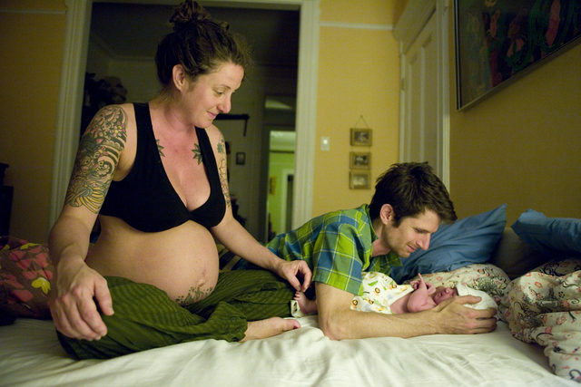 <p>Samantha Huggins and her husband, Jonathan, gazed at their daughter in their bedroom moments after her birth in their Greenpoint&nbsp;home in 2009.&nbsp;</p>
