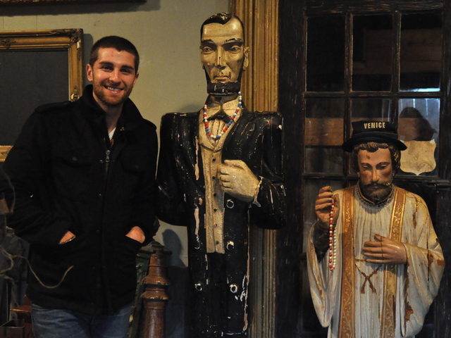 <p>Second Stop Cafe regular Zach Hertlein scoped out the antiques for sale in the former cafe, which closed at the end of 2012 without any formal announcement or sign.</p>
