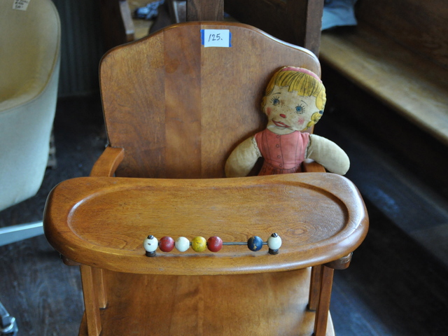 <p>An antique high chair is among the furniture sold at Second Stop's temporary store.</p>
