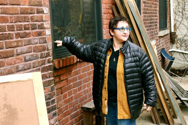<p>Sheila Goloborotko shows how high the floodwater rose in her studio during Sandy.</p>
