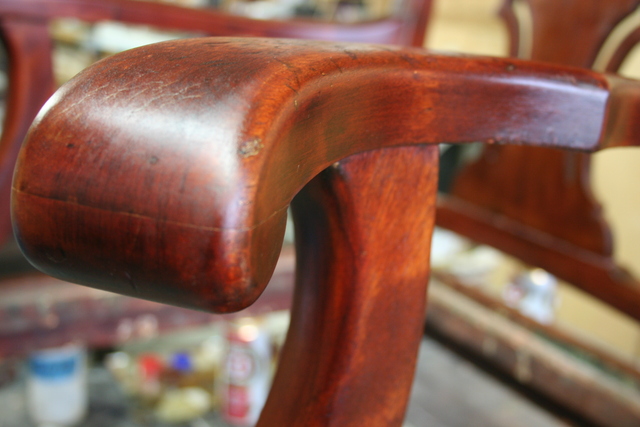 <p>Once the stain is down, go to town with the shellac. This is what brings out the rich shine and depth. Wood has a personality and there's no point in changing it. This chair had a natural reddish hue and zebra pattern.</p>
