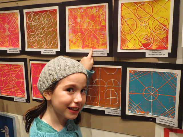 <p>Sydney Calzavara shows off her print at the East Side Children's Art Show which took place on Wednesday evening, Jan. 16, 2013 at Sotheby's (1334 York Ave.) This is the sixth such annual art show.</p>
